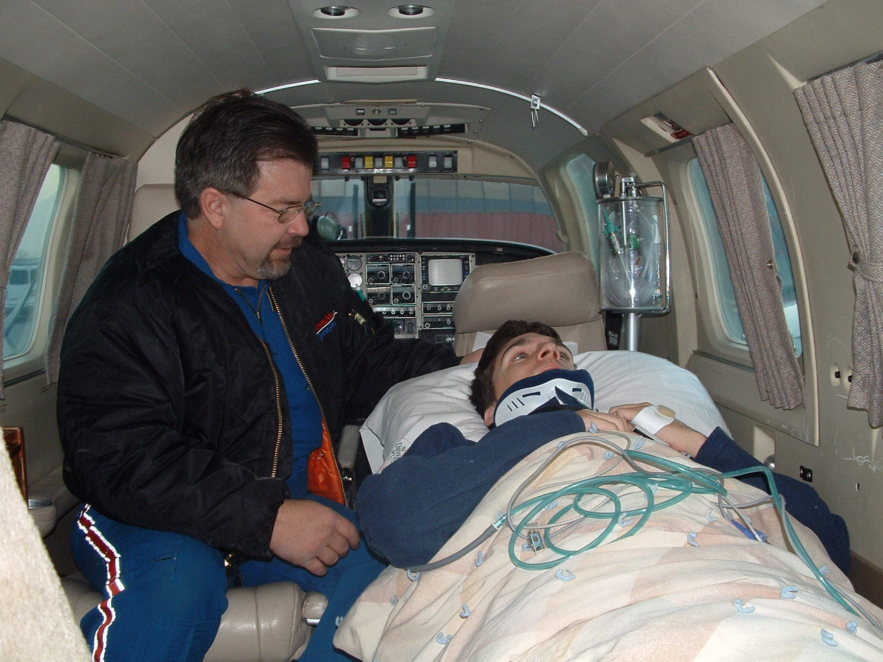 And here's inside! It was very small. Enough room for me, my mom, the guy in that pic, and the pilot. That’s pretty much it. Anyway we flew down and they did all sorts of admissions tests. Oh! Lol. Ok, so I had to be tested once for the hospital admittance, once for the tests records, and once for… fun? I don’t remember what the third one was for. But one of the tests is to figure out where I can and can’t feel. So they take a cue tip and start from the top and work down. So like they brush my cheek and I'm like “yeah I can feel that.” And then like 2 places on my neck, then about collar bone level, and so on, including between every pair of ribs. And remember I can’t really feel pretty much from armpit level down, so most of it was a waste. Anyway that’s not the best part, so after they do that whole test with a cue tip, they do it with a safety pin. And they have you tell them if it feels sharp or blunt or not at all. So now they stick me with a safety pin in 1000 places. Luckily I can only feel like 10% of them, but they did this test 3 times in one day!! Yeah, ok moving on.